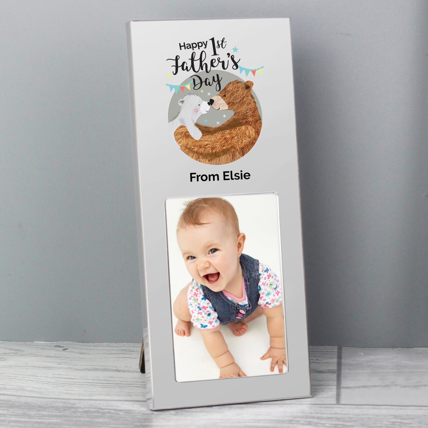 First Fathers Day frame with Daddy and Baby Bear illustration and room for a 2 x 3 inch photo. Personalise with your own message of up to 30 characters including spaces. Aluminium frame.