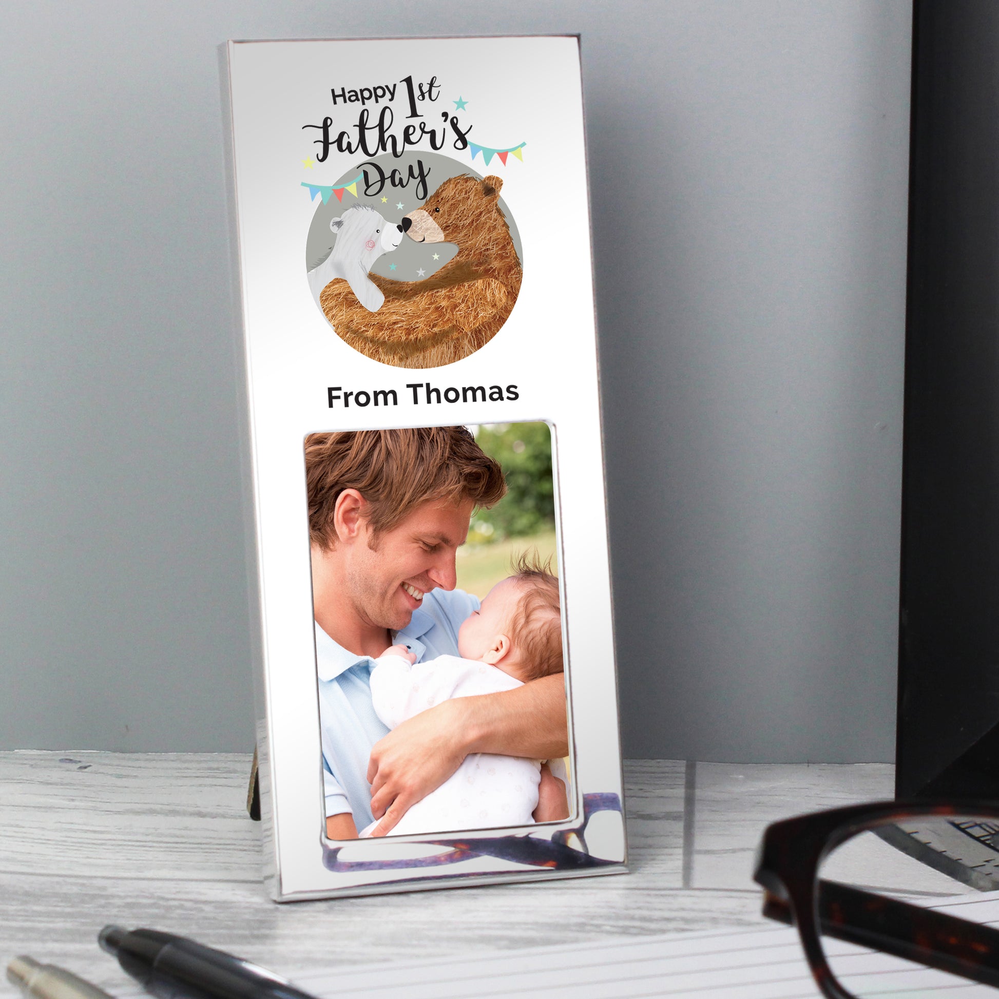 First Fathers Day aluminium frame with Daddy and Baby Bear illustration takes a 2 x 3 inch photo. Personalise with your own message of up to 30 characters including spaces. 