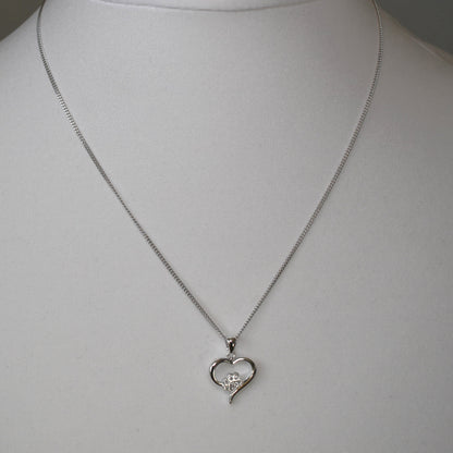 Silver heart shape necklace with crystal cubic zirconia paw print on 18" sterling silver diamond cut chain