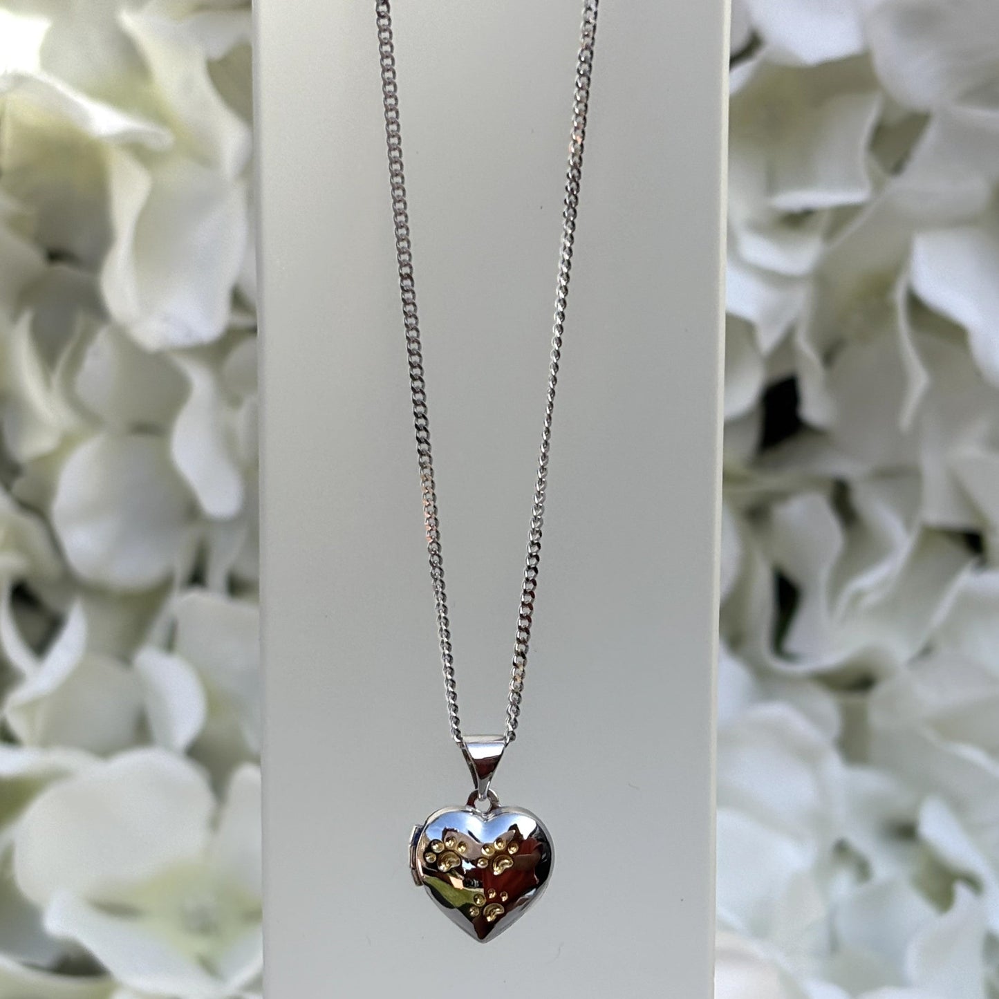 Heart-shaped paw print opening photo locket on sterling silver chain