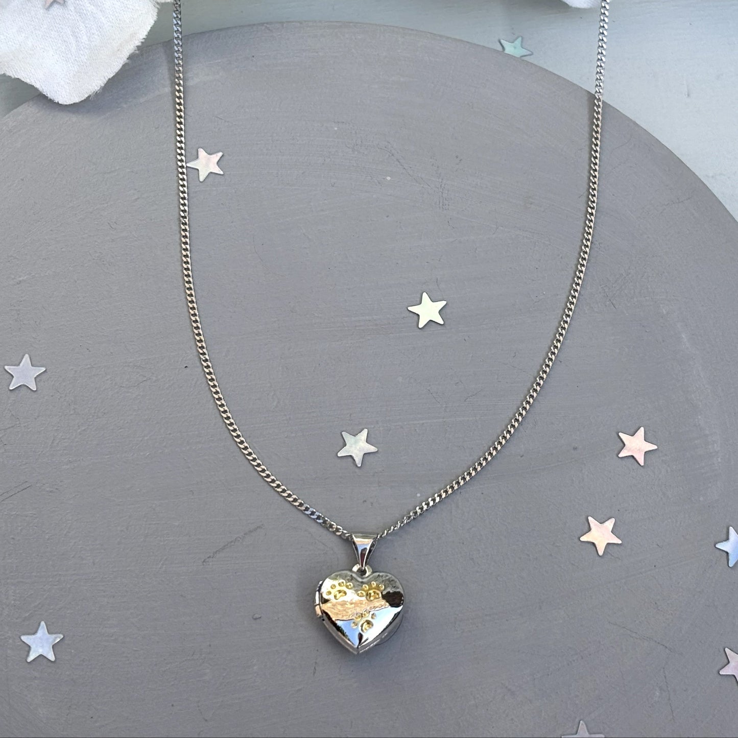 Heart-shaped paw print opening photo locket on sterling silver chain