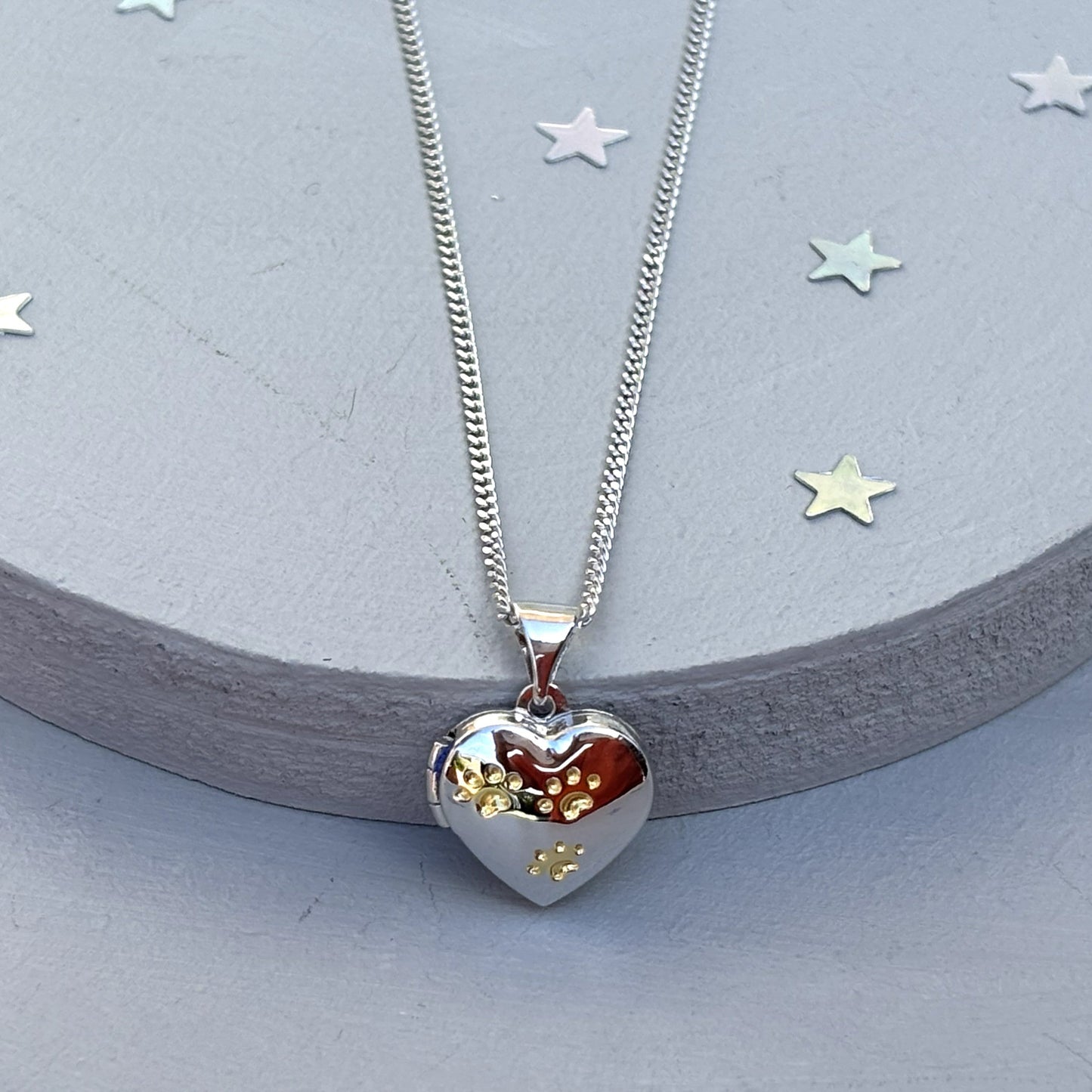 Heart-shaped paw print opening photo locket on sterling silver chain