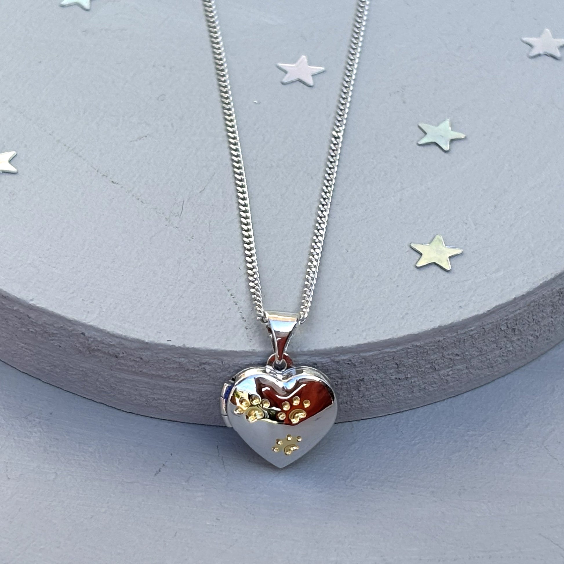 Heart-shaped paw print opening photo locket on sterling silver chain