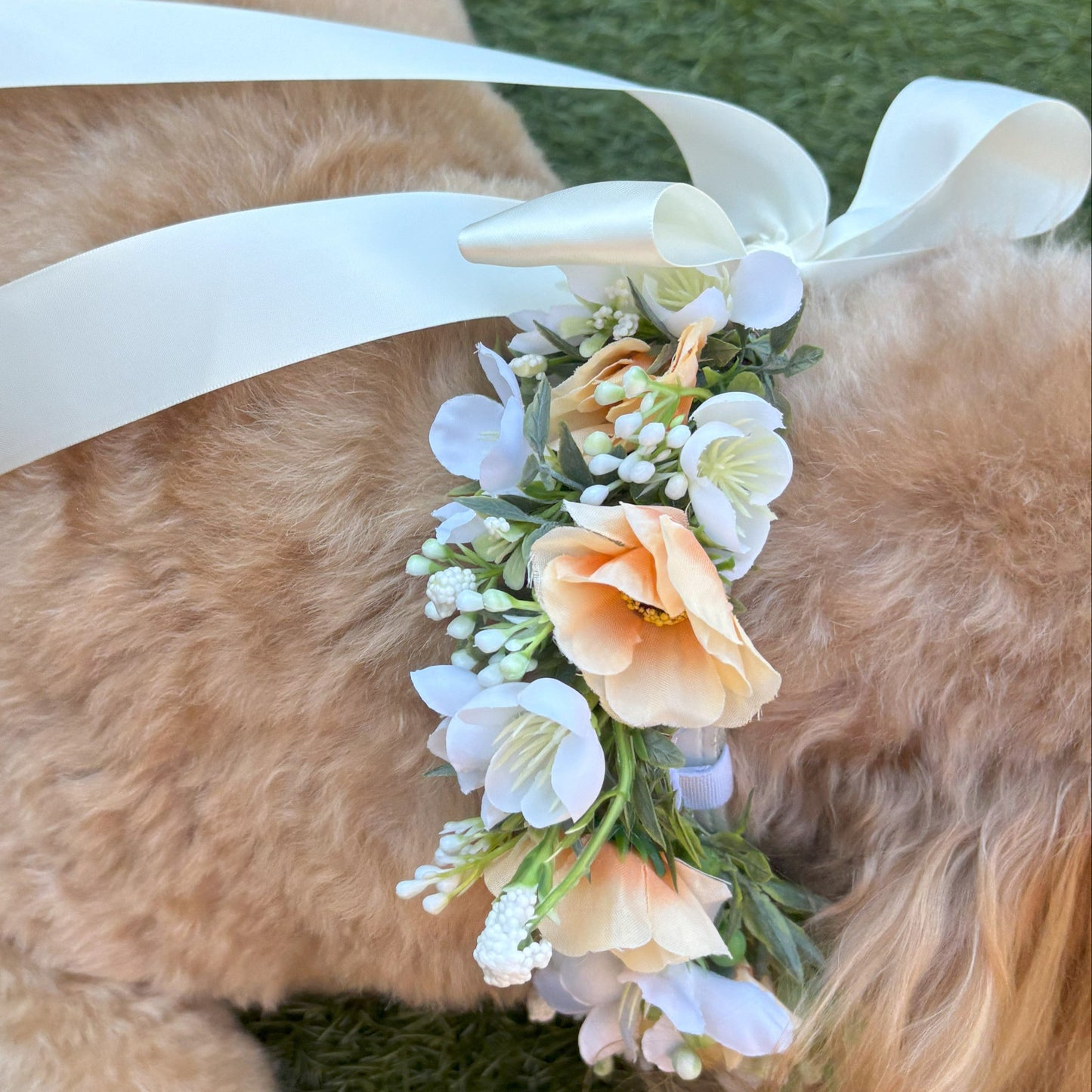 Full Flower Garland Dog Collar. Silk flower dog collar has a blend of buds and blossoms and a hint of woodland greenery, finished with ivory satin ribbon and attached to a white leather collar. Optional Ring Bearer Clasp