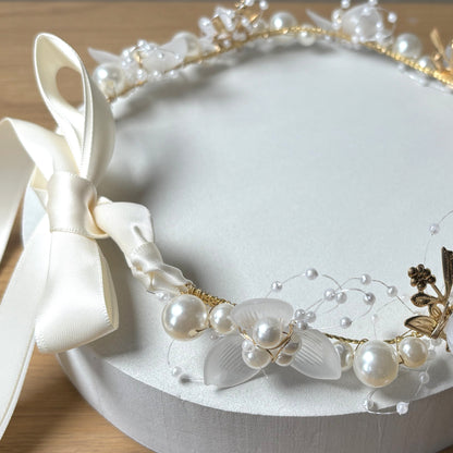 Pearl beaded dog collar tied with satin ribbon