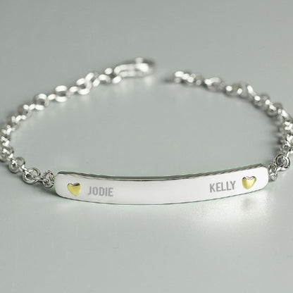 sterling silver bracelet engraved with two names and a tiny gold plated heart beside each