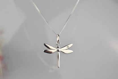 Dragonfly is sterling silver with a sparkling cubic zirconia crystal on its wing.
