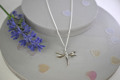 Dragonfly is sterling silver with a sparkling cubic zirconia crystal on its wing.