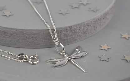 Dragonfly is sterling silver with a sparkling cubic zirconia crystal on its wing.