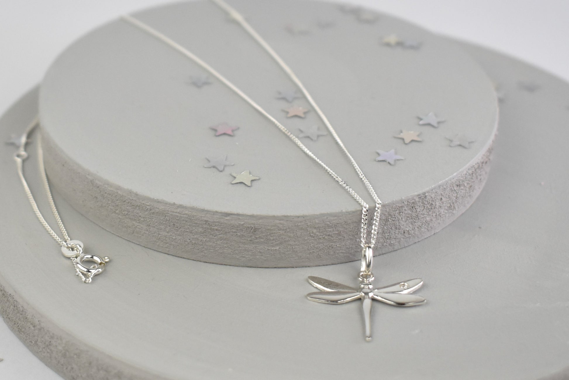 Dragonfly is sterling silver with a sparkling cubic zirconia crystal on its wing.