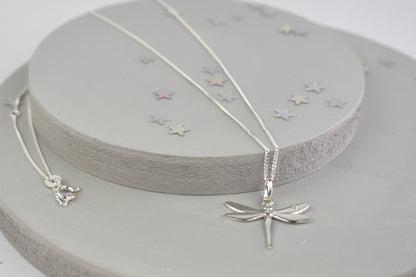 Dragonfly is sterling silver with a sparkling cubic zirconia crystal on its wing.