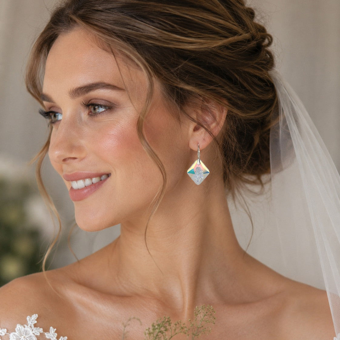 Bride wars a crystal rhombus earring with a design to indicate that the crystal is still evolving. Firmly secured by sterling silver leverbacks