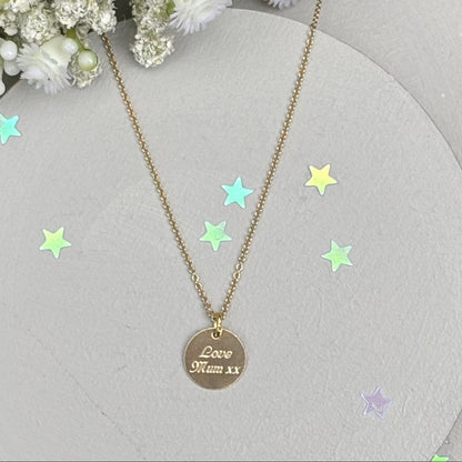 delicate Gold Filled Birth Flower Pendant. Crafted on an 11mm coin pendant, this simple piece is engraved with the intricate design of birth flowers on the front side and on the reverse side features a hidden personalised engraving, making it truly unique.