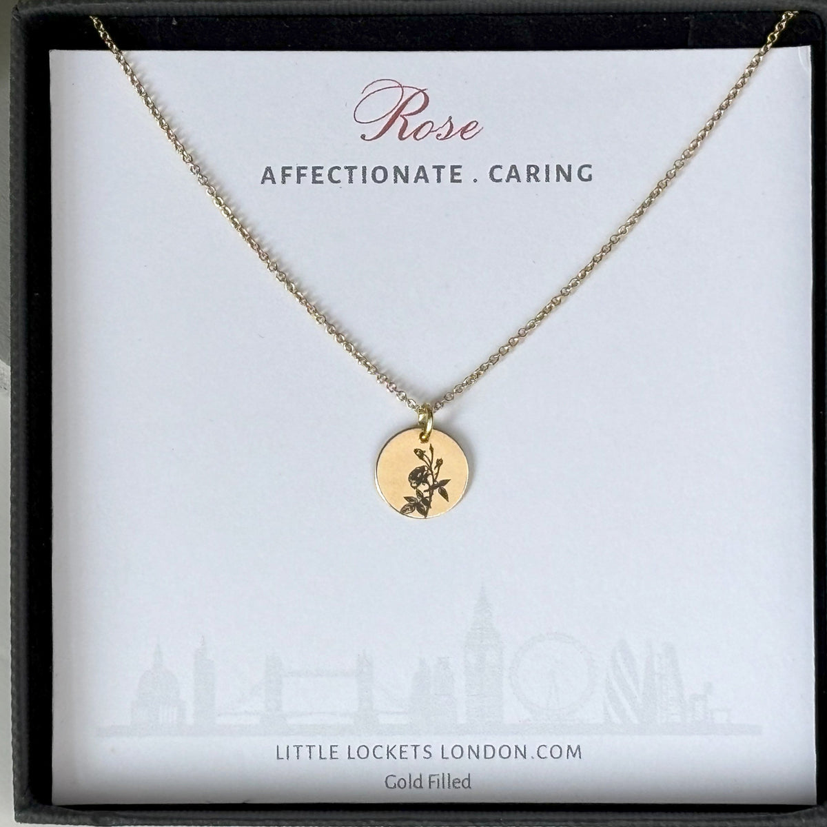 delicate Gold Filled Birth Flower Pendant. Crafted on an 11mm coin pendant, this simple piece is engraved with the intricate design of birth flowers on the front side and on the reverse side features a hidden personalised engraving, making it truly unique.