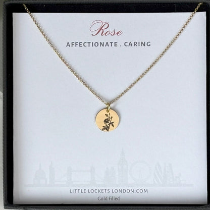 delicate Gold Filled Birth Flower Pendant. Crafted on an 11mm coin pendant, this simple piece is engraved with the intricate design of birth flowers on the front side and on the reverse side features a hidden personalised engraving, making it truly unique.