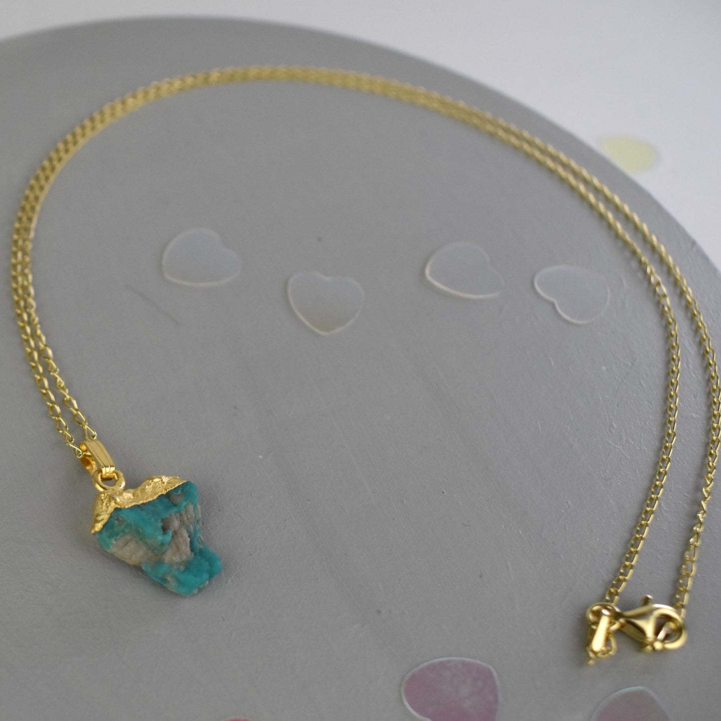 Gold raw crystal necklace with a turquoise pendant 