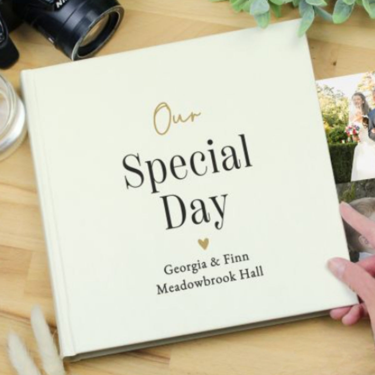 Square wedding photo album with gold and black personalisation