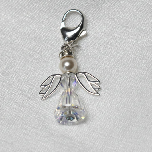 A crystal and pearl angel attached to a strong sterling silver caribiner