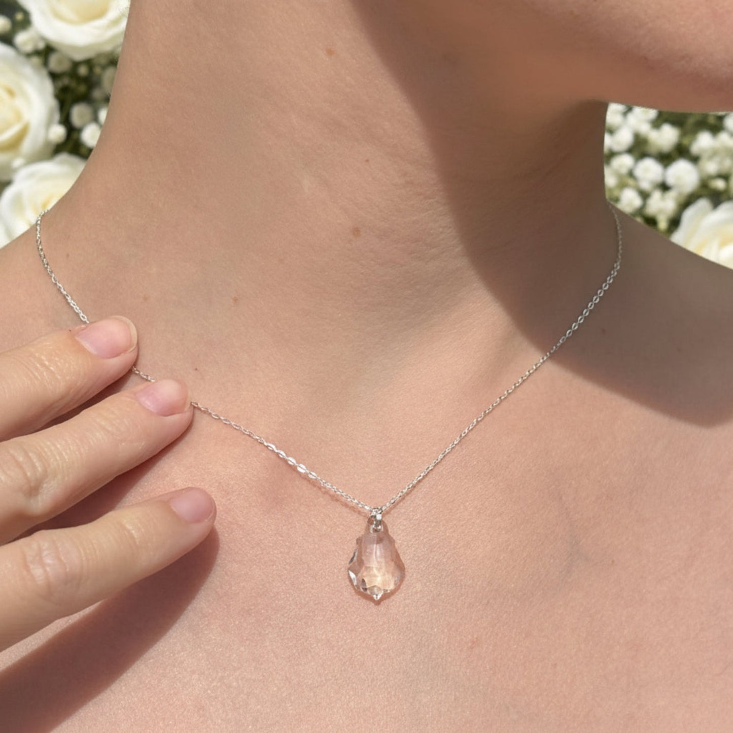 Our simple Baroque pendant features the highest quality crystal drop suspended from a sterling silver adjustable chain. The back of the necklace features two further bqroque drops, making it the perfect back drop necklace for wedding or cocktail dresses.
