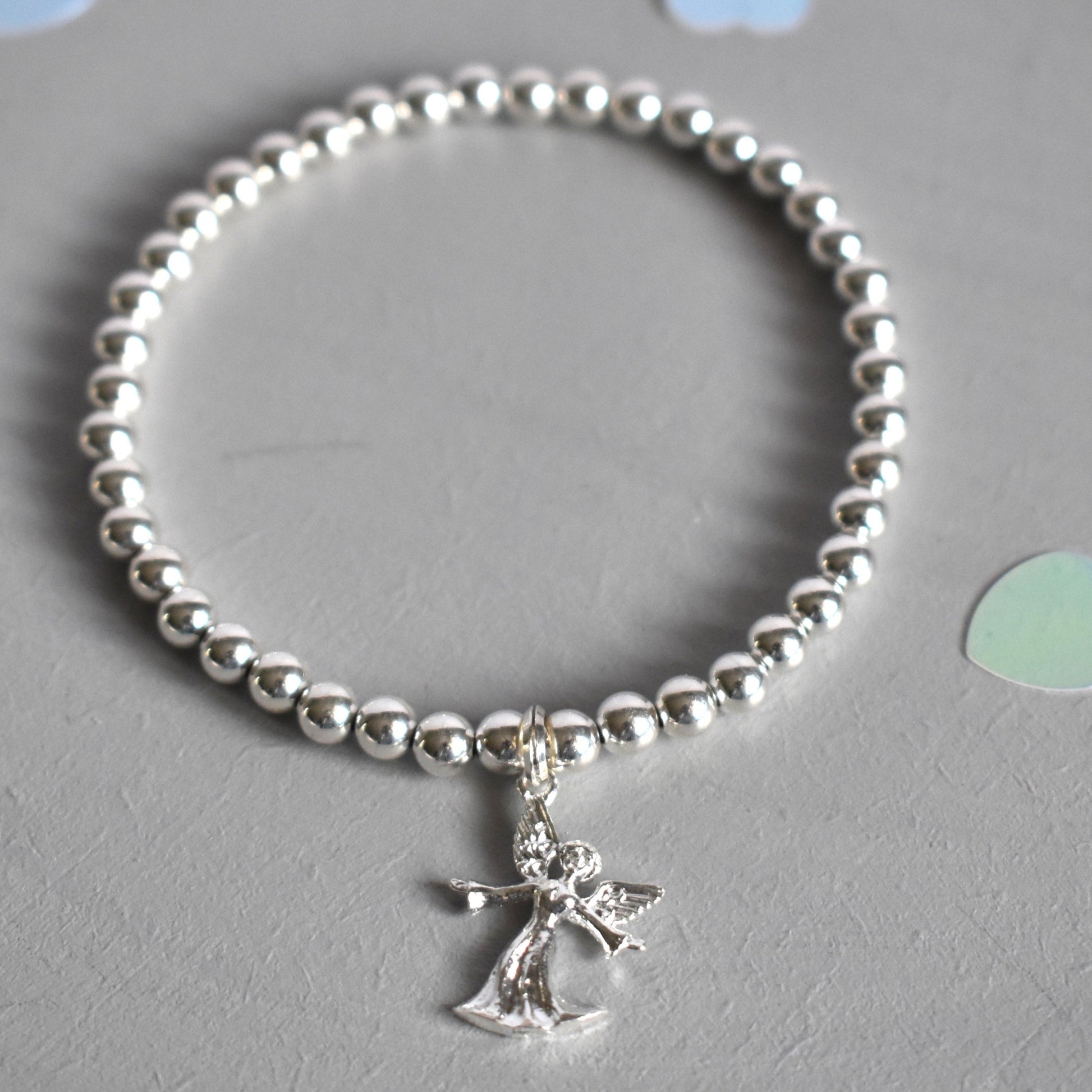 Sterling silver beaded bracelet with 4mm beads and a 16mm sterling silver angel charm
