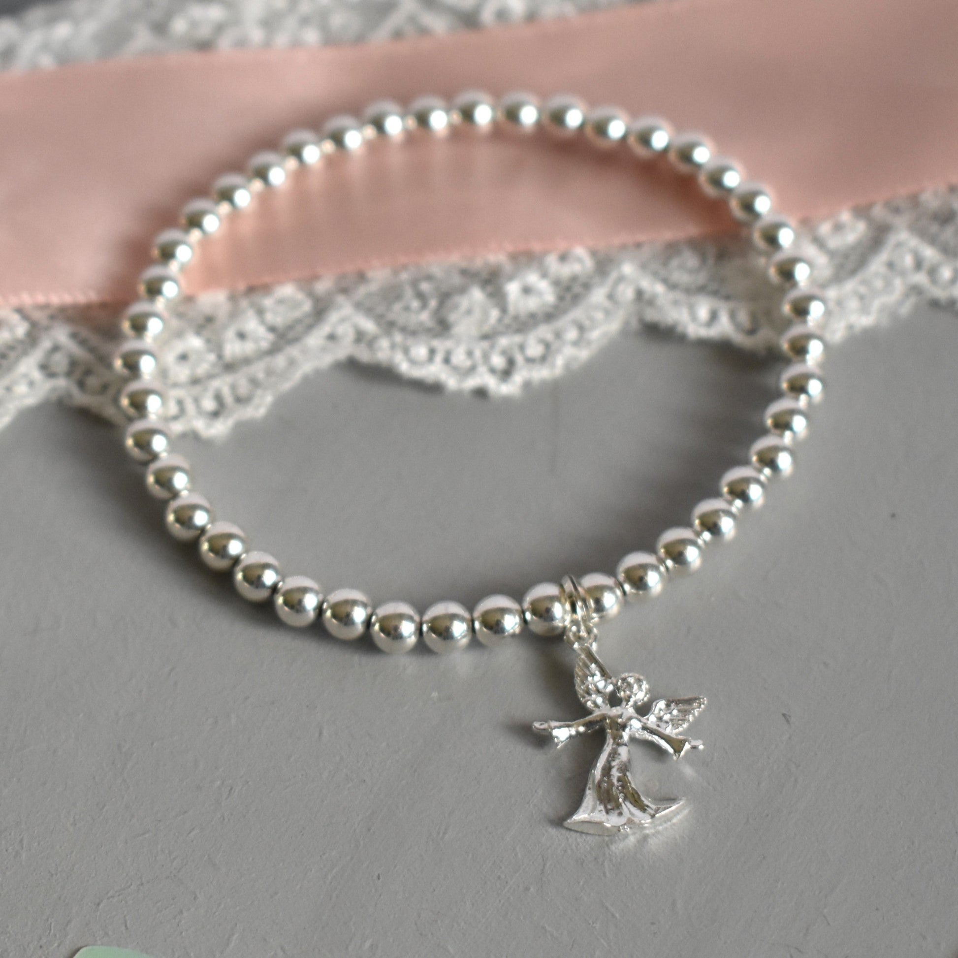 Sterling silver beaded bracelet with 4mm beads and a 16mm sterling silver angel charm