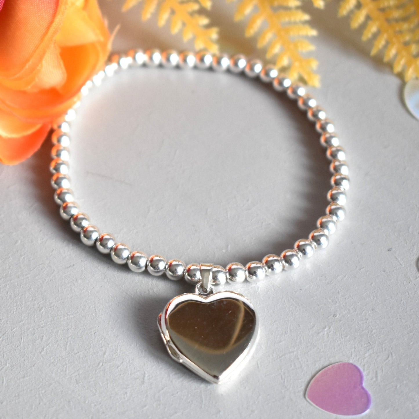 Sterling silver beaded bracelet with opening heart shaped photo locket