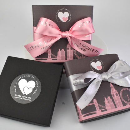 Your gift will arrive in a branded gift box or choose to upgrade to a London Skyline wrap with a choice of hand tied pink or grey brandedribbon