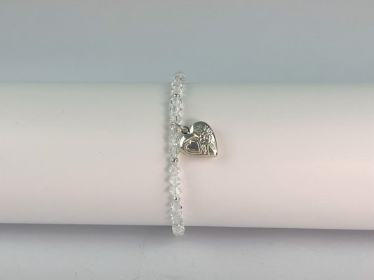 sparkling crystals form an elasticated bracelet with a small opening locket for you to attach a photo of your choice