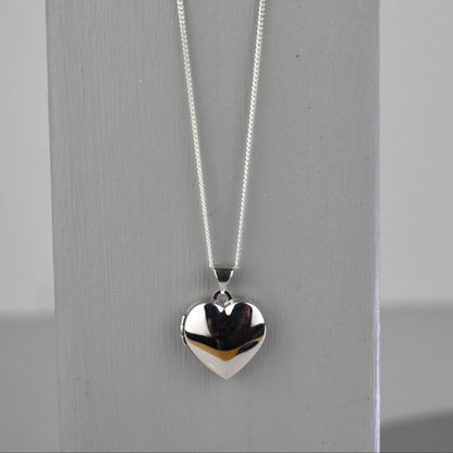 sterling silver heart locket on 14" sterling silver chain. 