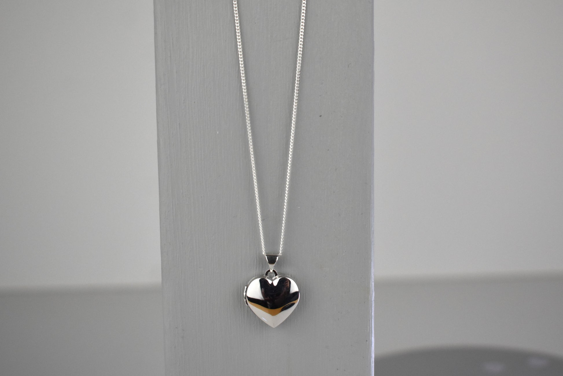 sterling silver heart locket on 14" sterling silver chain. 