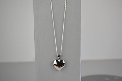 sterling silver heart locket on 14" sterling silver chain. 