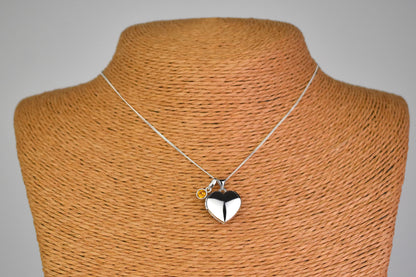 sterling silver heart locket on 14" sterling silver chain. Shown with optional birthstone
