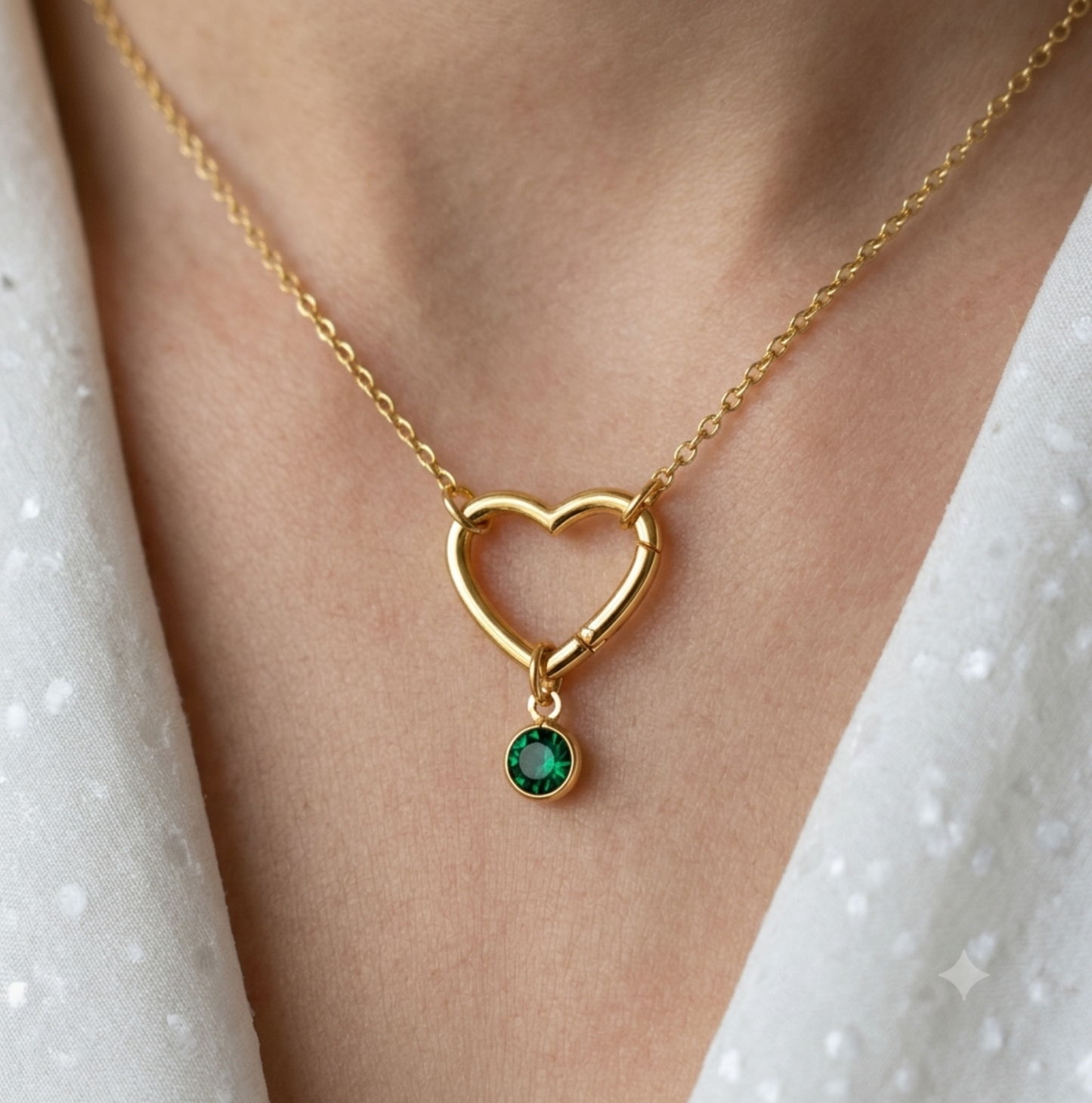 The gold hinge heart necklace shown with an optional birthstone