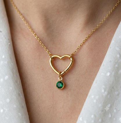 The gold hinge heart necklace shown with an optional birthstone