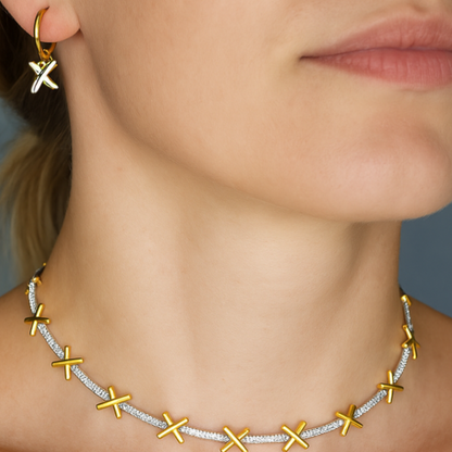 The golden kisses necklace. Sterling silver gold plated "kisses" separated by sparkling zircona bars. Shown with matching "kisses" earrings.