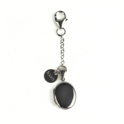 Sterling silver oval pendant shown with spring clasp fastening and engraved round tag