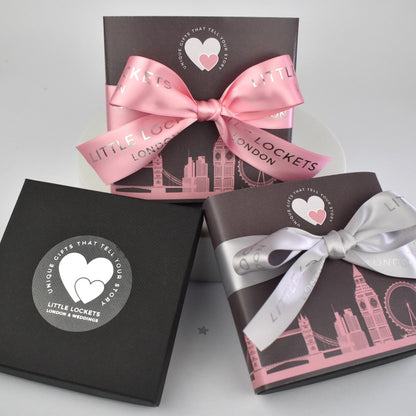 Your infinity necklace will be mounted on card and presented in a branded gift box. Upgrade your gift wrap by adding a London skyline wrap secured with grey or pink hand tied ribbon.