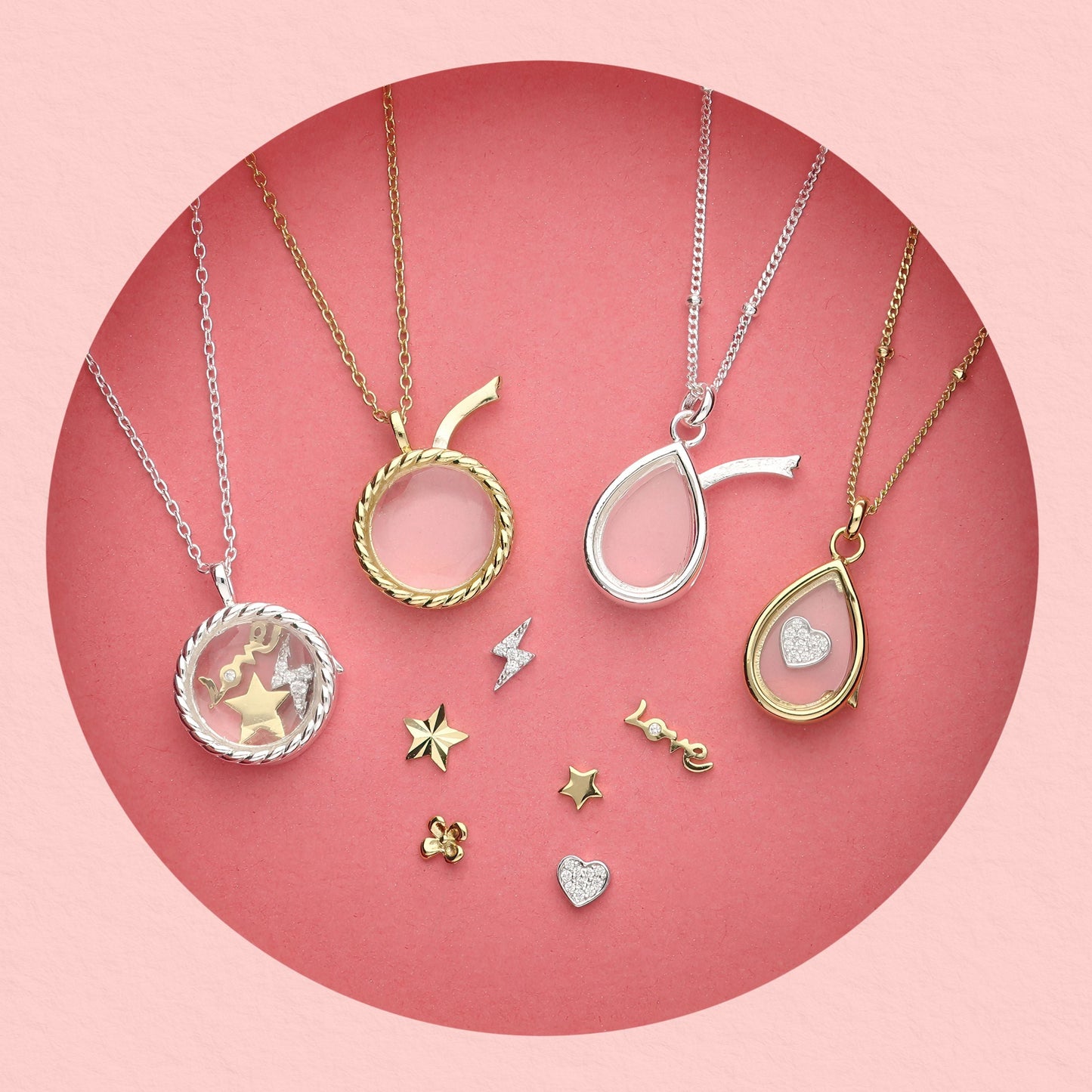 Collection of glass locket necklaces in gold and silver with interchangeable mini charms including stars, hearts, lightning bolt, and 'love' text charm,