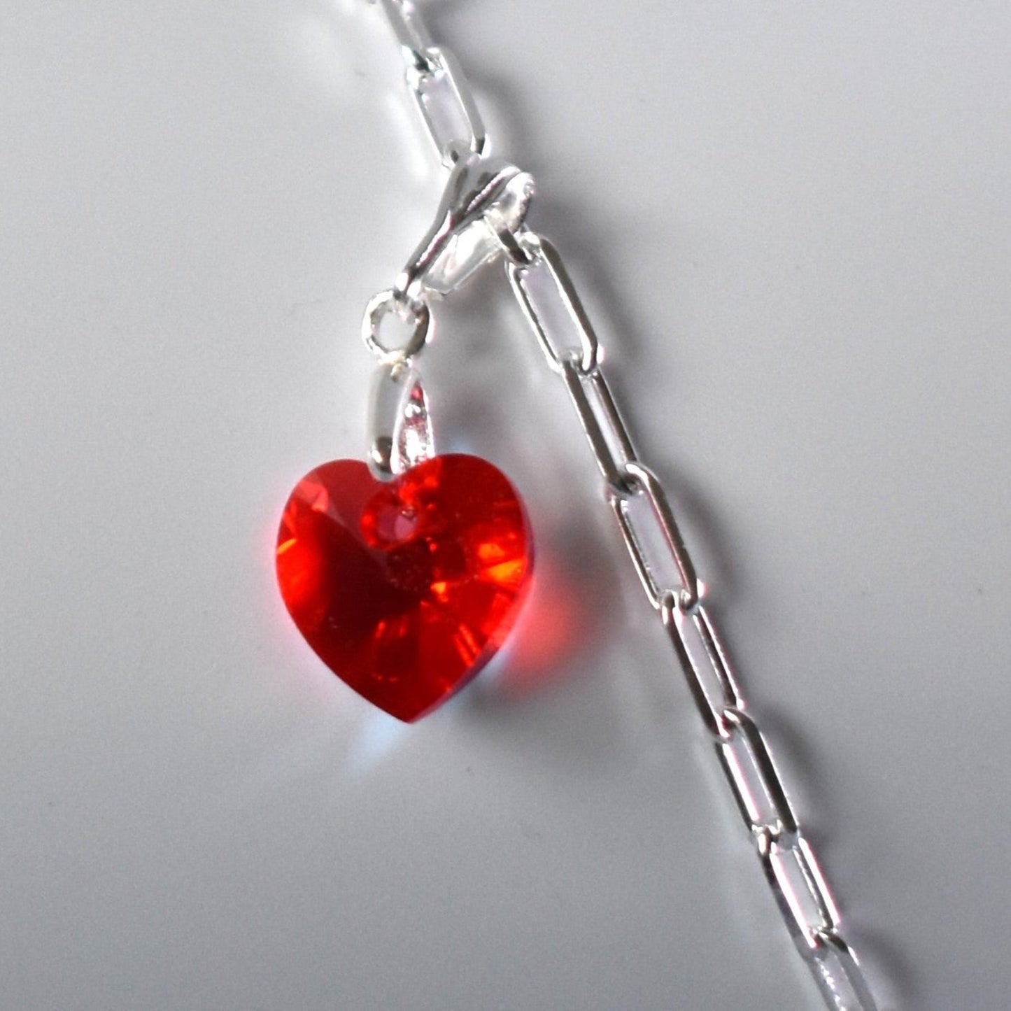 Sterling silver paperclip anklet with high quality crystal heart charm in your choice of colour.  Close up of heart