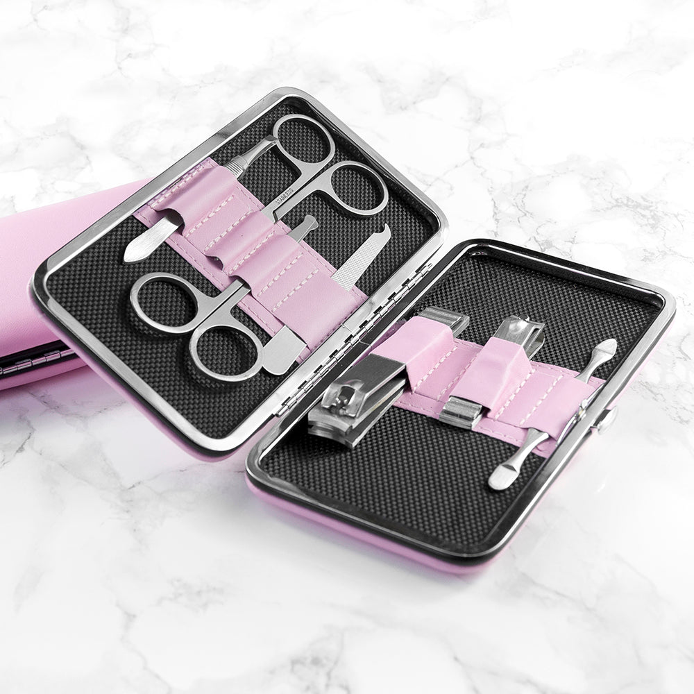 Manicure set with scissors, clippers, and other tools in a pink case
