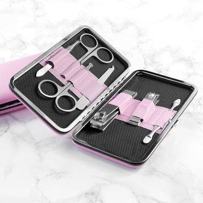 Manicure set with scissors, clippers, and other tools in a pink case
