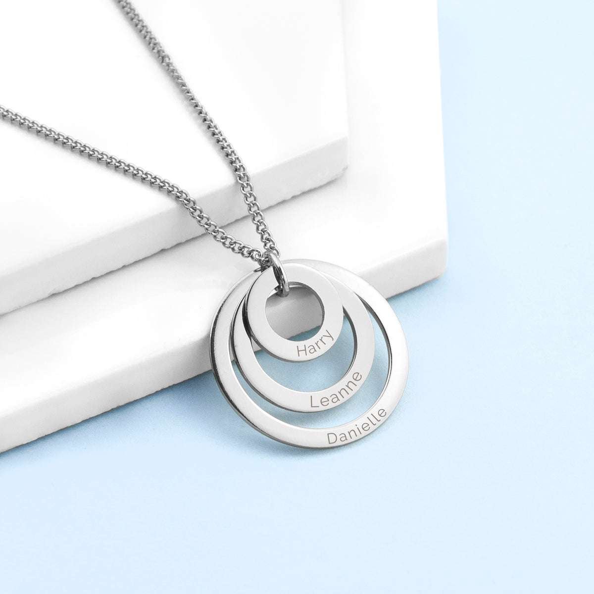 Three ring necklace shown in gold finish, each graduating-sized ring bears an engraved name of your choice,