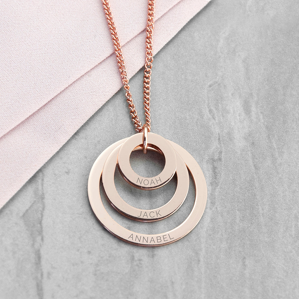 Three ring necklace shown in gold finish, each graduating-sized ring bears an engraved name of your choice,