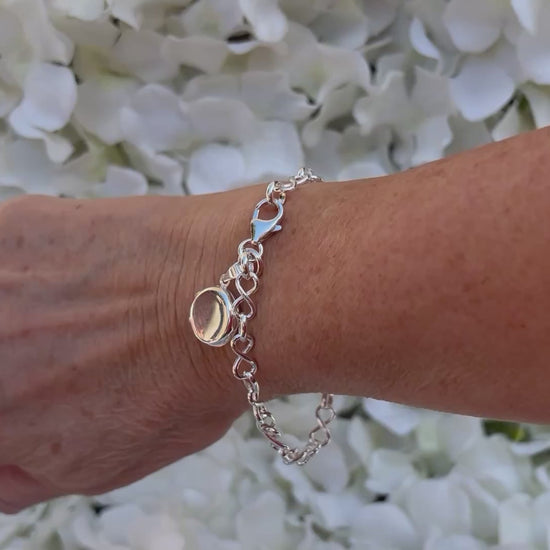 Sterling silver miniature locket on infinity link bracelet