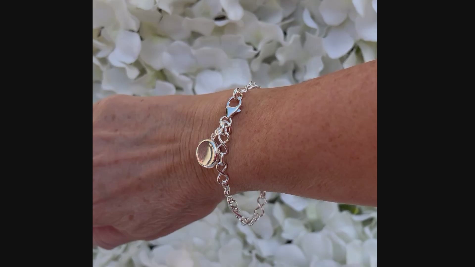 Sterling silver miniature locket on infinity link bracelet