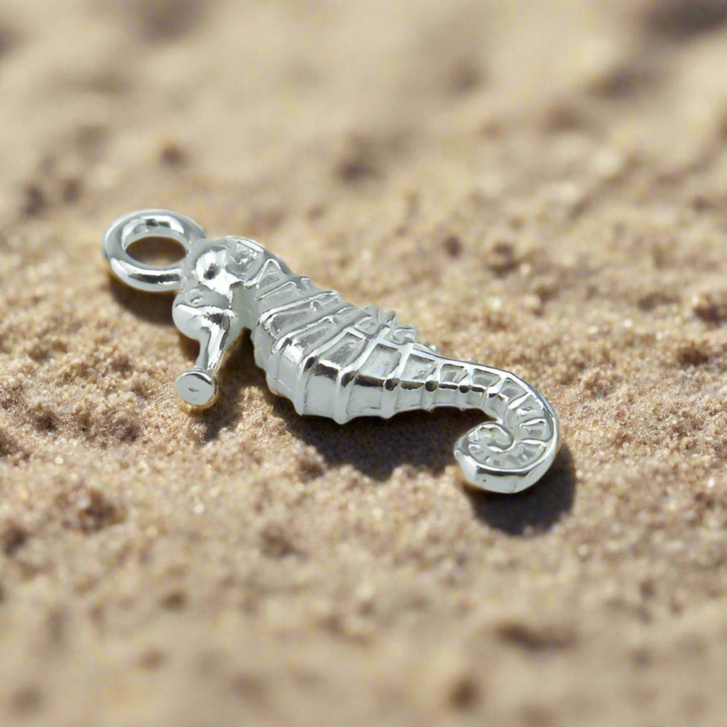Our pretty seahorse charm shown in sterling silver