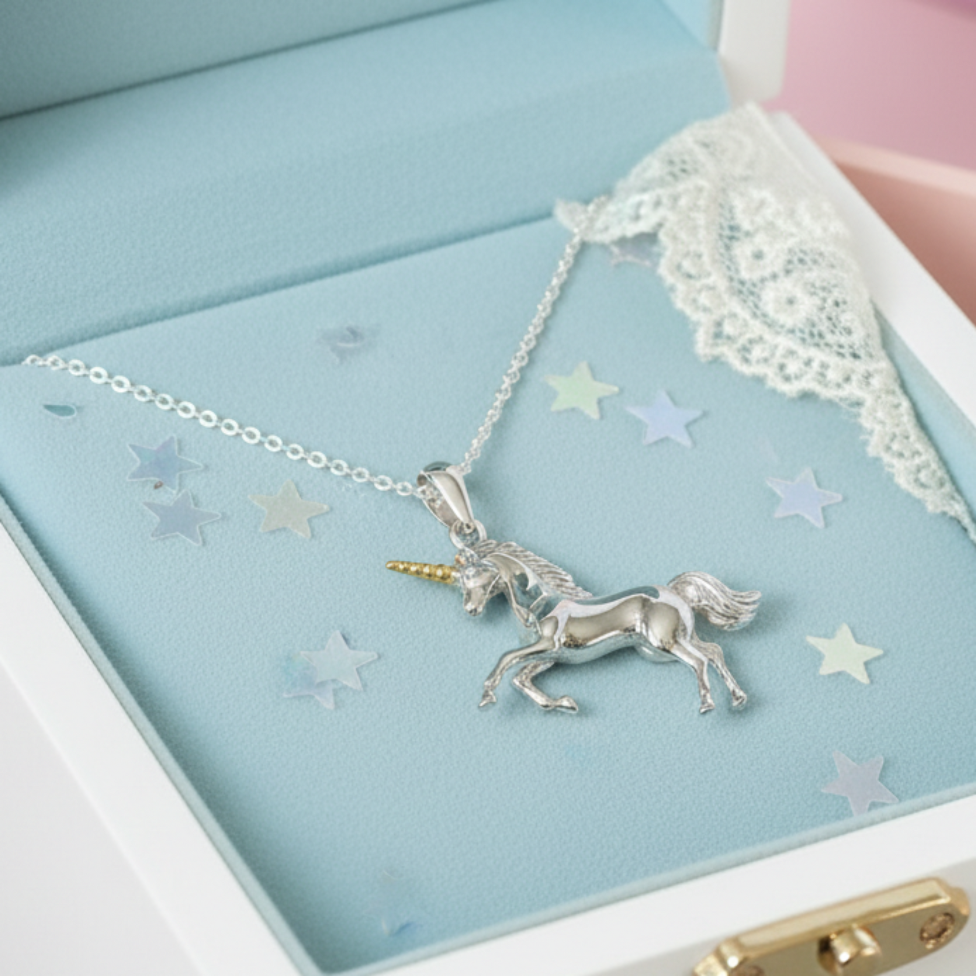 Unicorn necklace in an open jewelry box