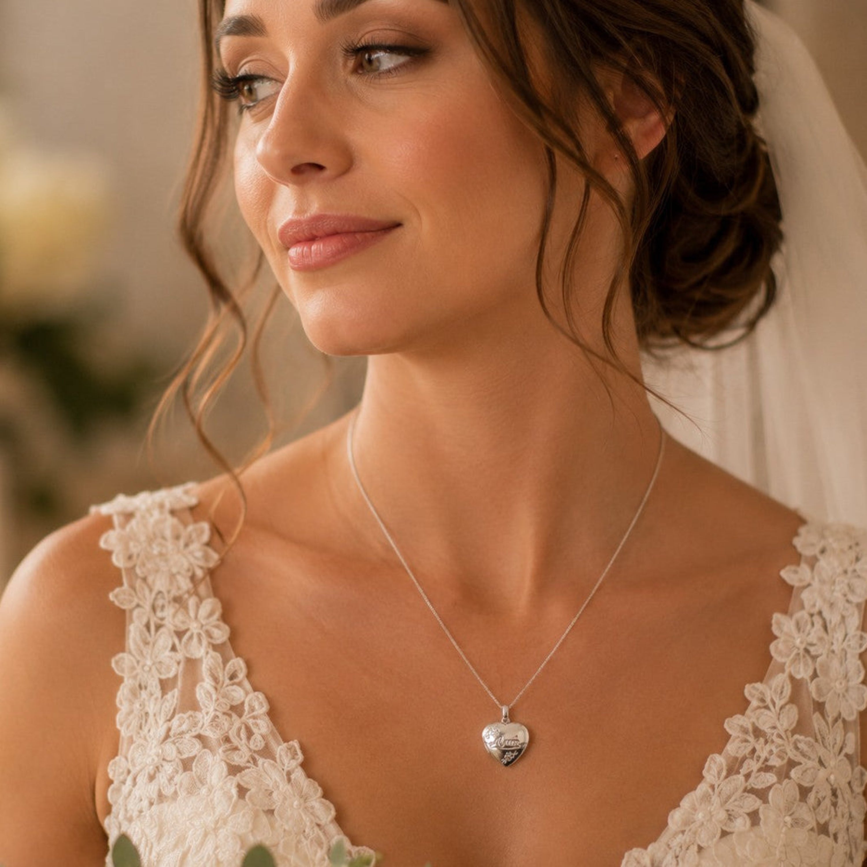 A bride wears a sterling silver locket engraved with the word "Mum" on her wedding day.