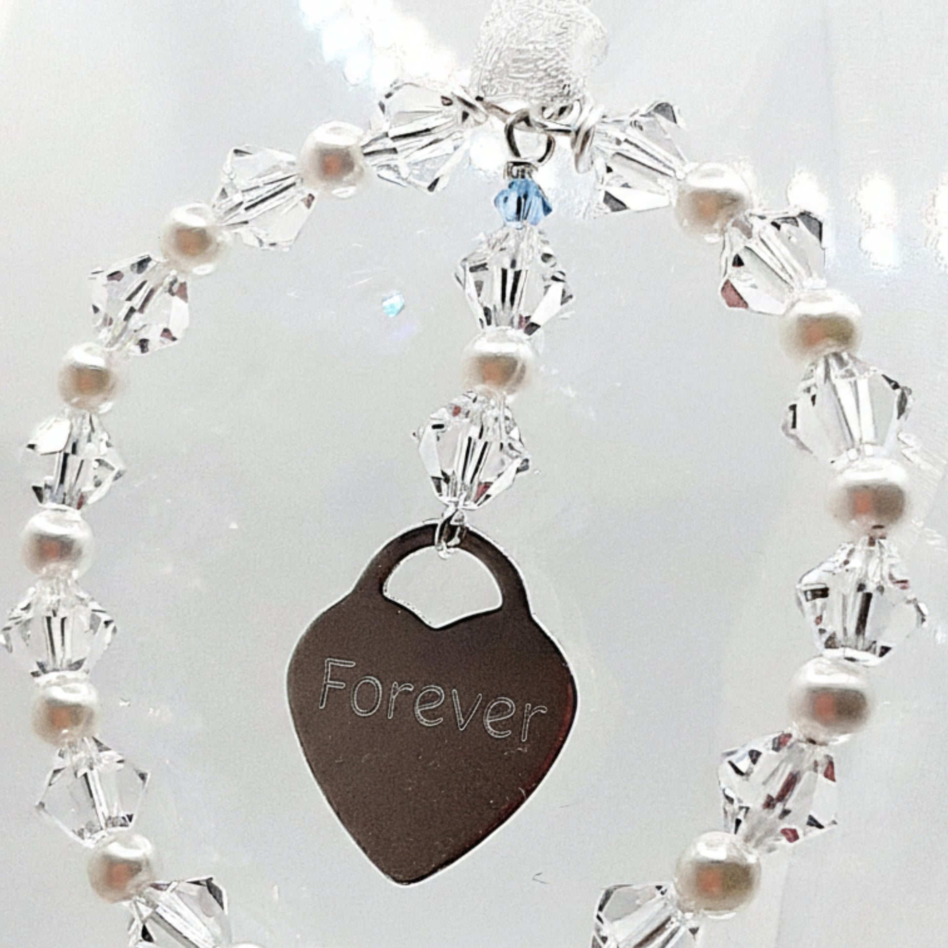 Personalised wedding bouquet charm with engraved silver heart, crystals, pearls, and 'Something Blue' bead. The heart can be engraved with wording of your choice