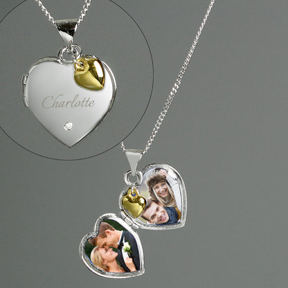 heart shaped locket with a tiny diamante on the front and engraved with a name of your choice in script font. The locket carries a tiny gold plated  heart. The locket can take up to two photos. Sterling silver chain.